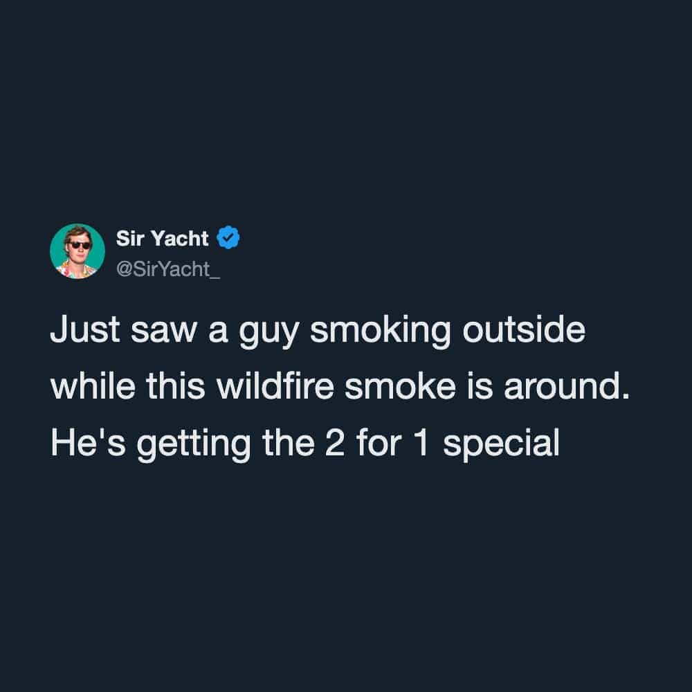 Witty social media text post joking about a person smoking cigarettes during wildfire smoke.